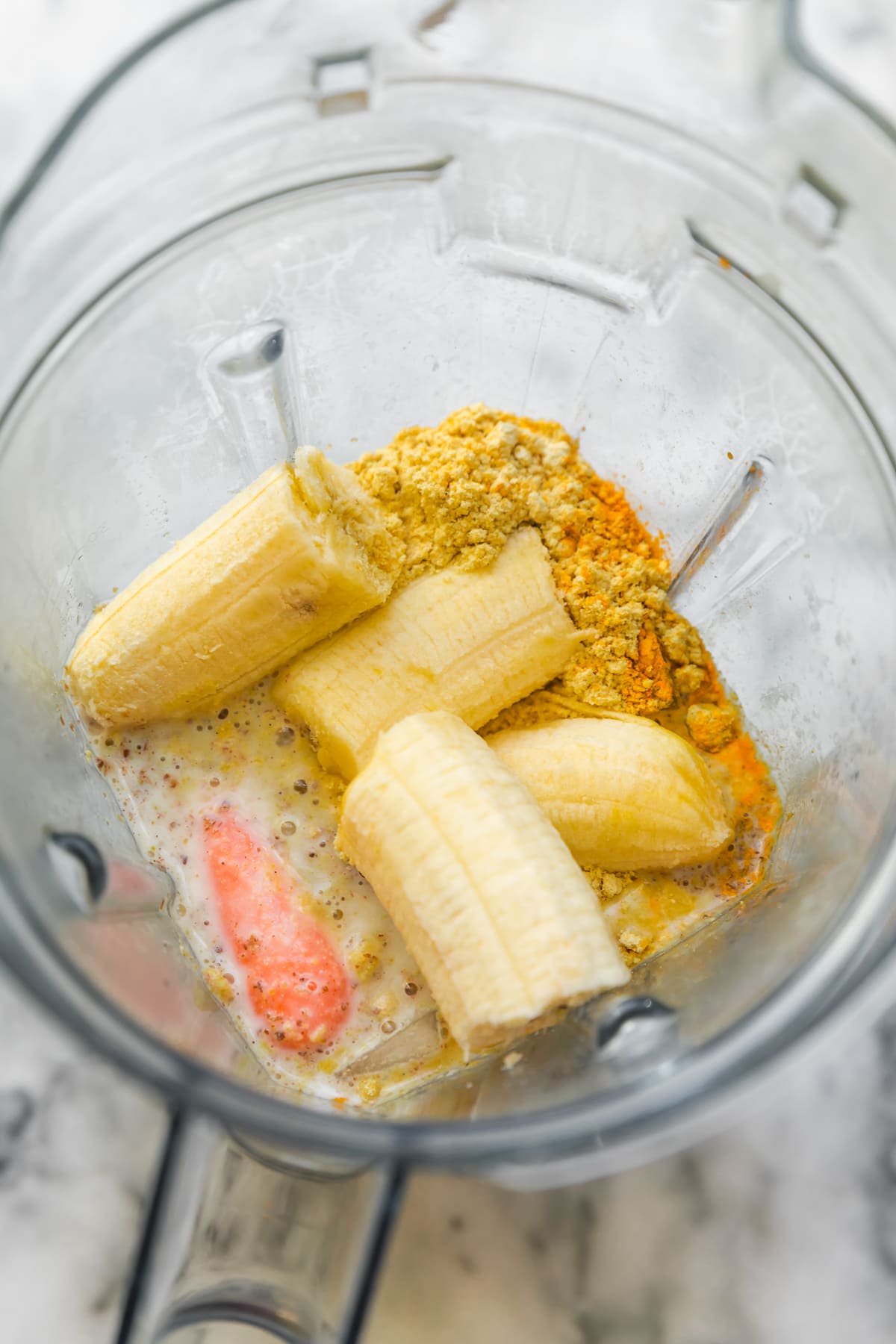Cenoura, banana, proteína em pó, linhaça e leite de amêndoa